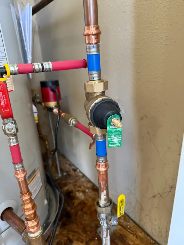New copper and PEX water heater piping with a mixing valve and recirculation pump